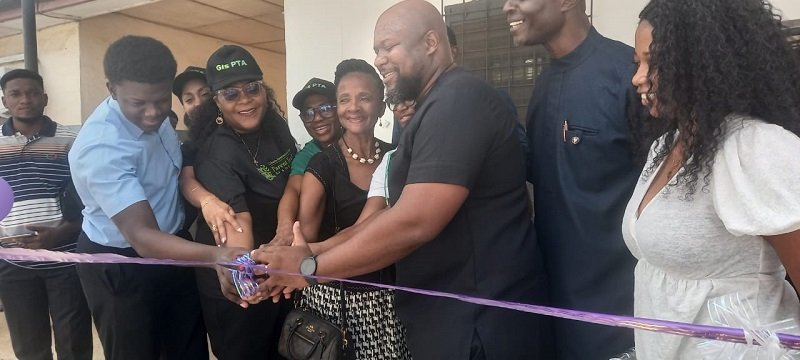 • Dr obeng (third from right) and others cutting the ribbon to open the facility