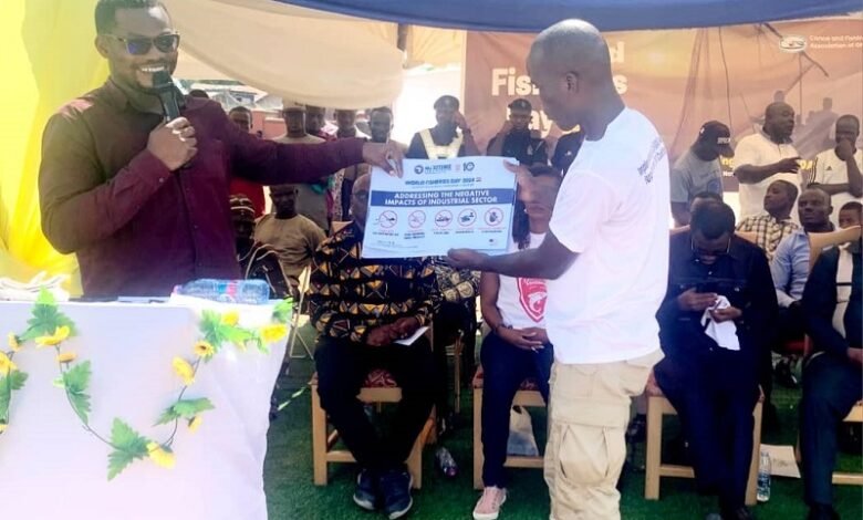 • Officials showing posters at the event