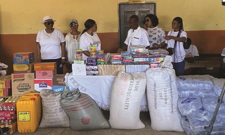 Ataa Lartey (third from right) receiving the items from members of the foundation