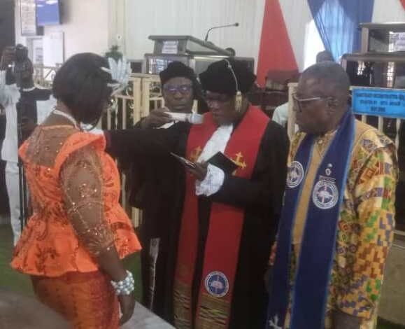 • Rt Rev.w Dr Agbeko (second from right) inducting Dr Mrs Otami Abutiate into office