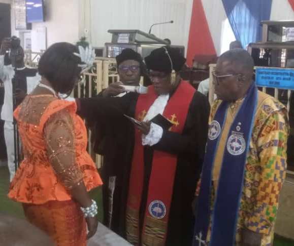 • Rt Rev.w Dr Agbeko (second from right) inducting Dr Mrs Otami Abutiate into office