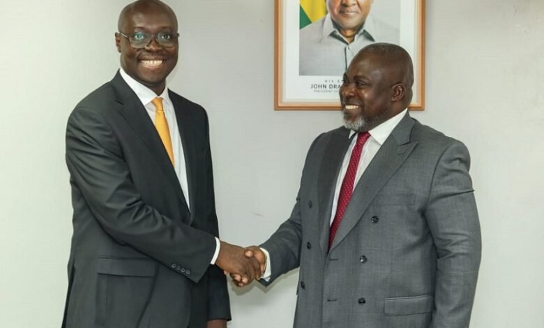 Forson (middle) in a chat with Mr Kwasi Agyei (left). With them is Mr Fiifi Kwetey