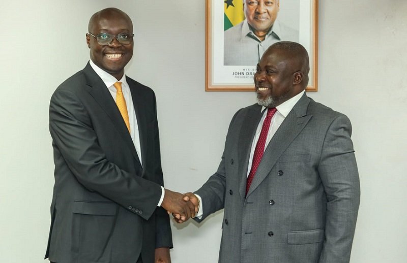 Forson (middle) in a chat with Mr Kwasi Agyei (left). With them is Mr Fiifi Kwetey