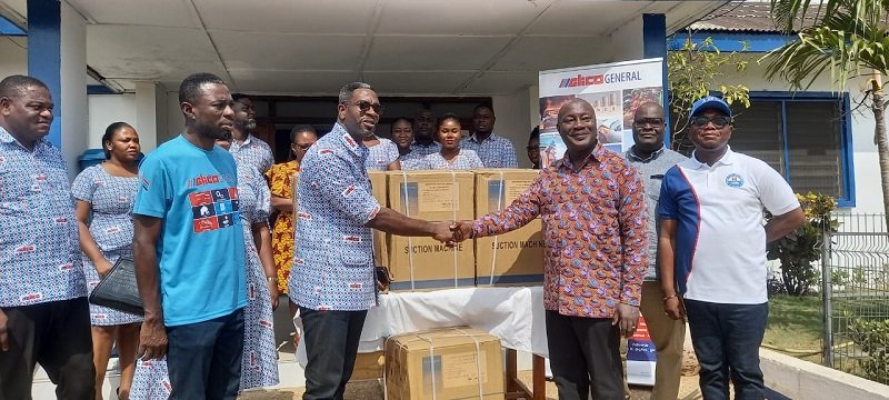 • Mr Andrew Achampong-Kyei presenting some of the items to Dr Richard Anthony