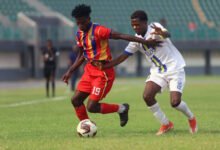 • Kwabena Boateng controlling the ball ahead of marker Pius Saletsi