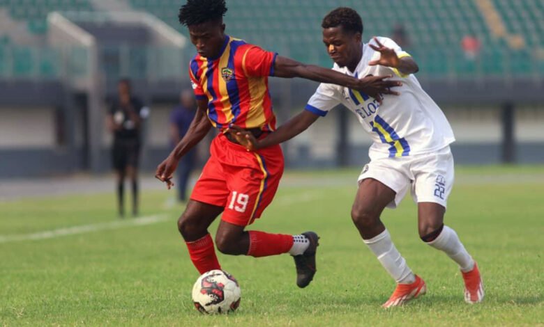 • Kwabena Boateng controlling the ball ahead of marker Pius Saletsi