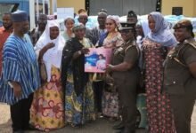 • Assistant Director of Prisons Victoria Adzewodah (third from right) receiving the items