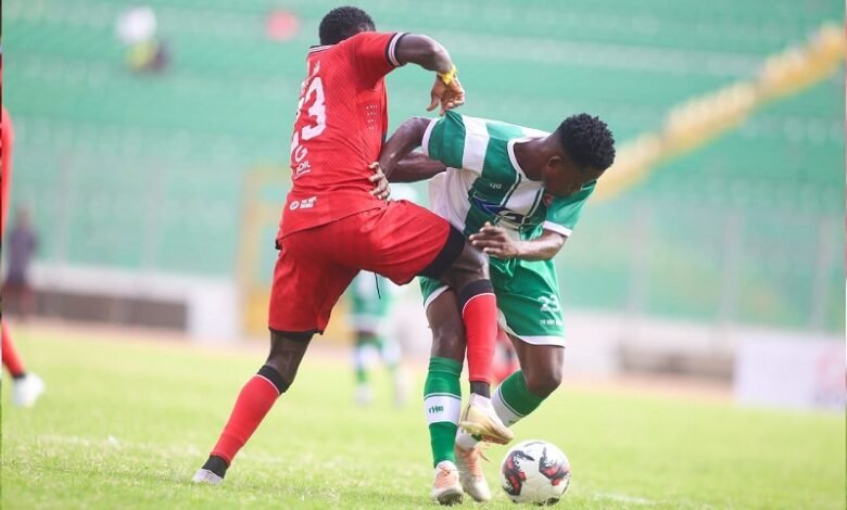 • Ebenezer Ackahbi (right) trying to outwits his marker