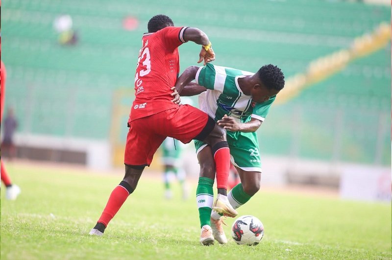 • Ebenezer Ackahbi (right) trying to outwits his marker
