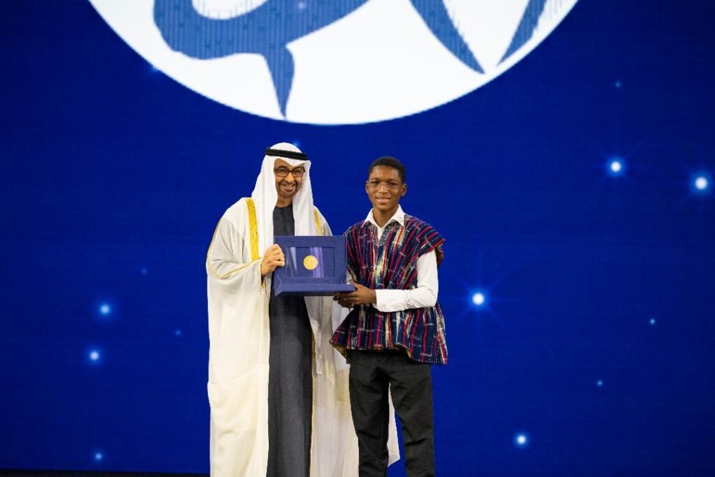 • Dr Lamya Fawwaz (left) presenting the award to a student of the school