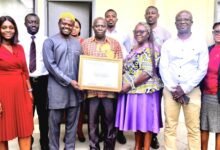 • Mrs Quaittoo (third from right) and Alhaji Abdul-Rahaman (second from left) holding the certificate. With them are other Management Staff of NTC and GSA staff Photo: Stephanie Birikorang