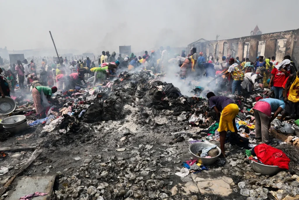 • Some of the traders scavenging through the burnt items