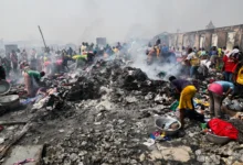 • Some of the traders scavenging through the burnt items