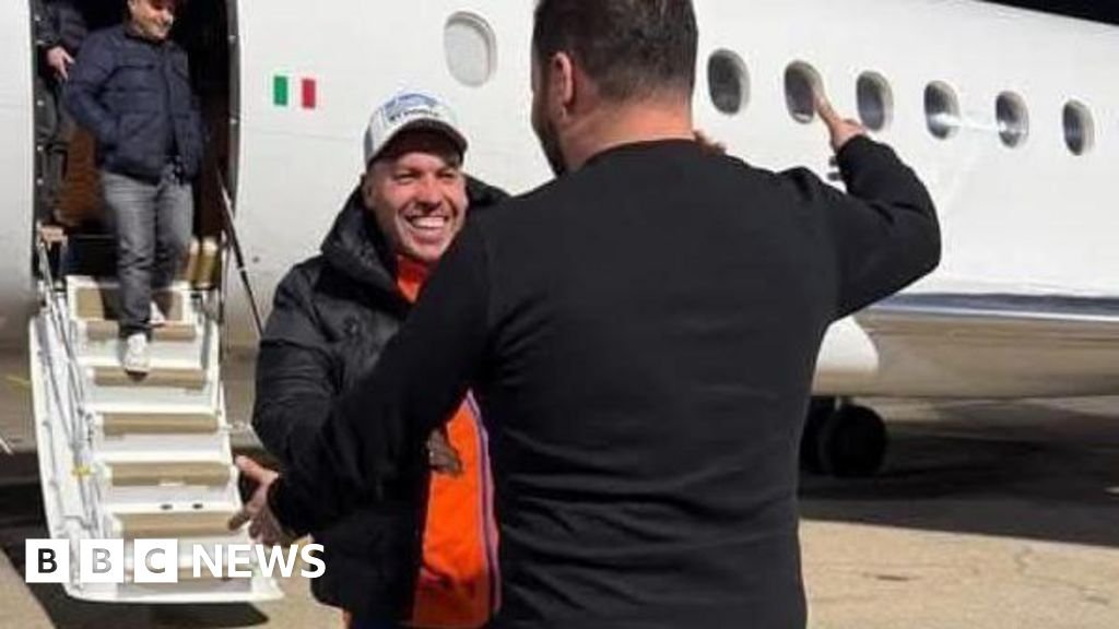 • Mr Najim (smiling) was flown back to Libya
