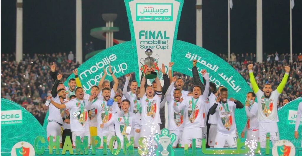 • A jubilant Mouloudia Club side after the trophy presentation