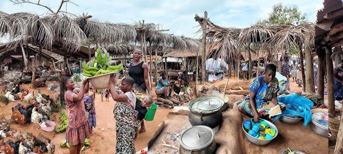 • Market women in Dambai busily at work