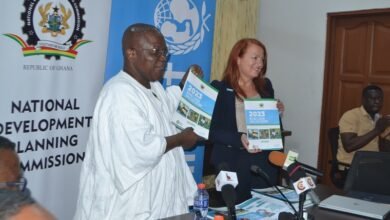 Dr Thompson (left) being assisted by Dr Paulina Sarvilahti to launch the DLT report Photo: Victor A. Buxton