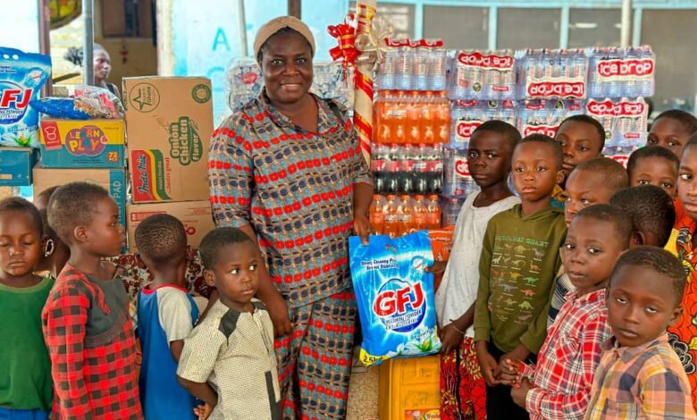 • One of the beneficiaries (second from right) receiving her item