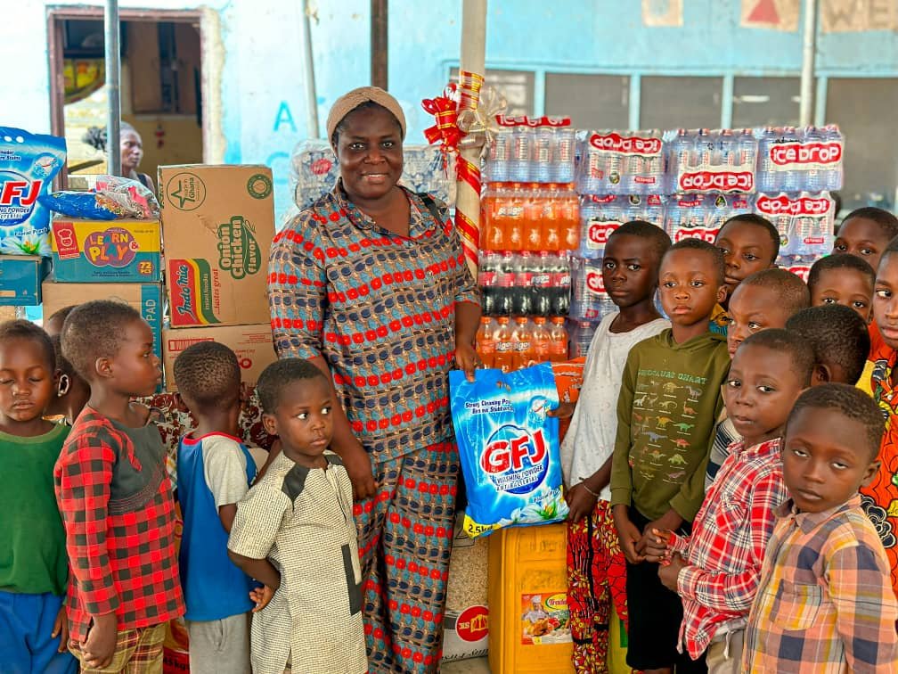 • One of the beneficiaries (second from right) receiving her item
