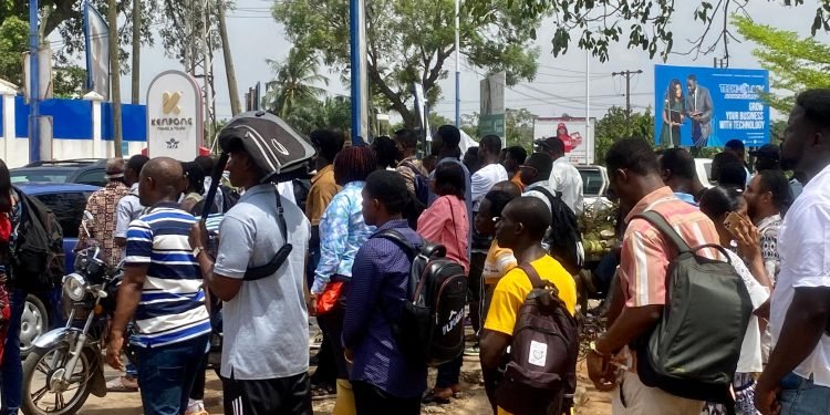 • Some visa applicants standing in a queue for appointment