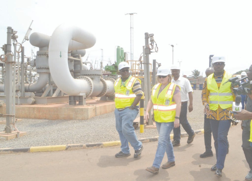 Mr Jinapor (right) with Ms Michelle Burkettor (middle) and other officials during the tour of the West Africa Gas Company at Tema Photo: Victor A. Buxton