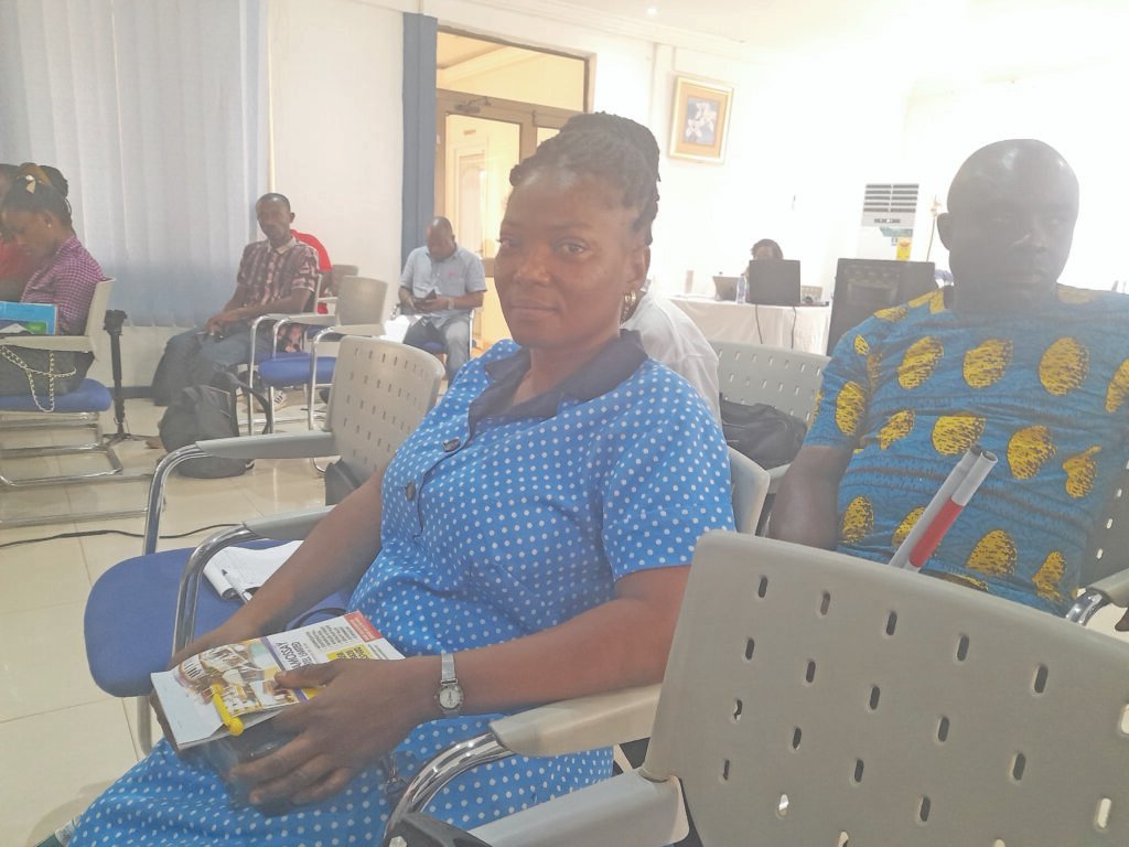 Sirina Mahamadu (inset) addressing participants in the meeting