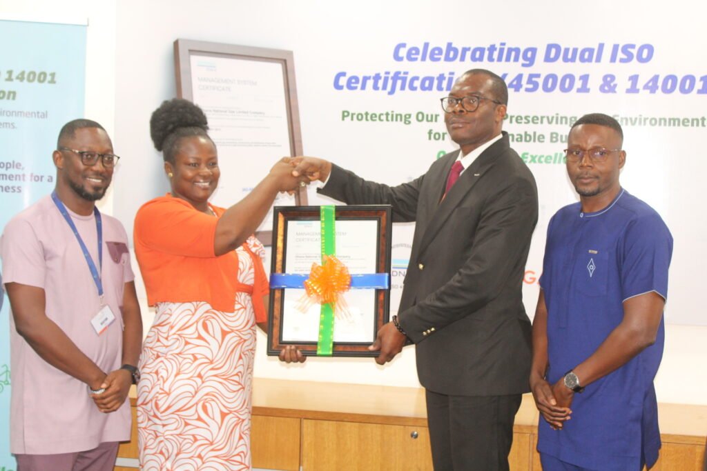 Dr Robert Kofi Lartey (second from right) receiving the ISO certificate from Madam Evelyn Keelson (second from left)