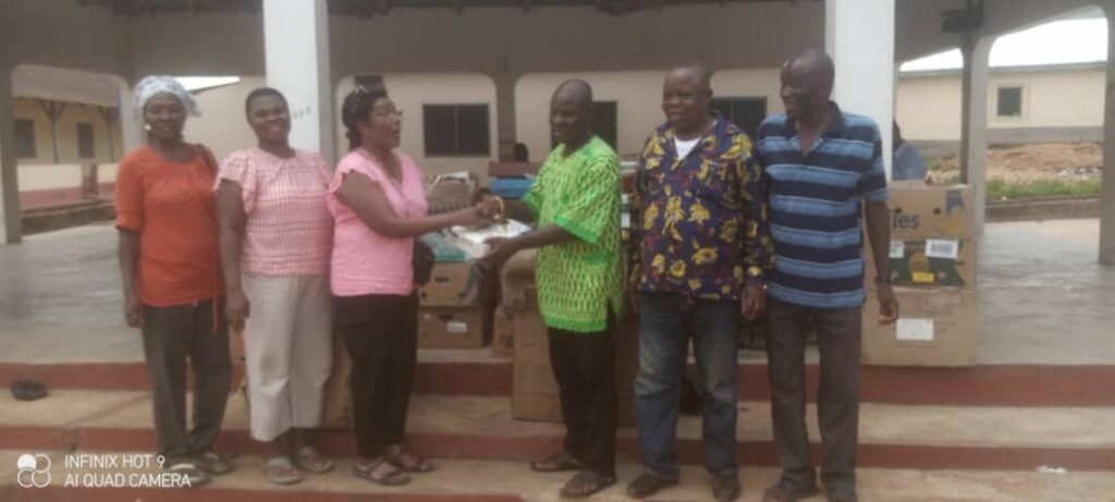 Ms Isabella Prowse (third from left) presenting the items