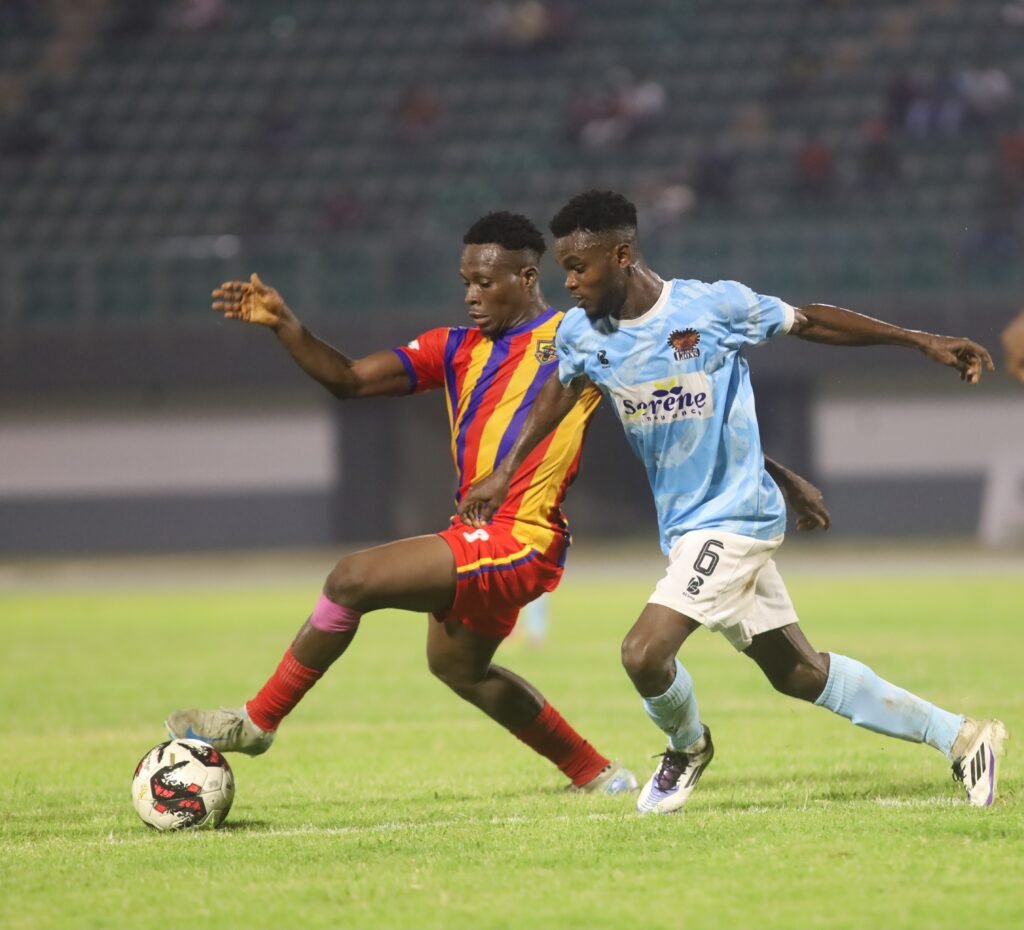 Hearts Hamza Issah (left) in a tussle for the ball with Ishmael Addo