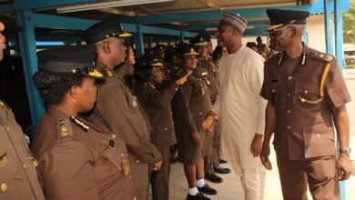 Alhaji Mohammed Mubarak Muntaka (second from right) interacting with some senior Prisons officers during his working visit to the Headquarters Photo: Ebo Gorman