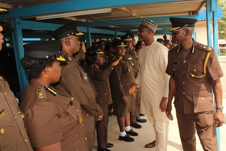Alhaji Mohammed Mubarak Muntaka (second from right) interacting with some senior Prisons officers during his working visit to the Headquarters Photo: Ebo Gorman