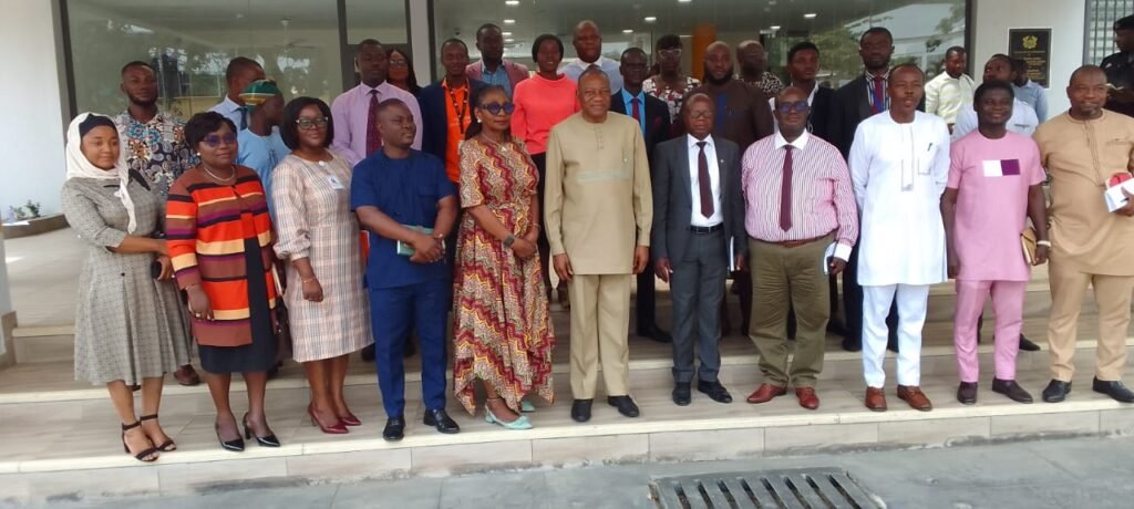 • Mr Pelpuo (middle) with staff of the ministry