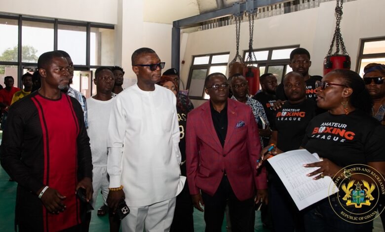 Madam Acquah-Harrison explaining a point to Mr Adams (second left) and other dignitries
