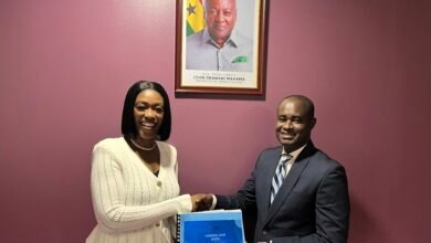 • Mr Agyenim-Boateng receiving the handover notes from Ms Duah-Yentumi