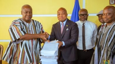 President Mahama (left) receiving the ORAL report from Mr Samuel Okudzeto Ablakwa (fourth from right). With them are ORAL team members