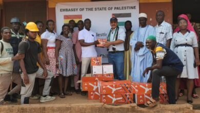 • Ambassador Abdalfatah Ahmed Khalil Alsatarri (middle) handing over the fans to the Mr Adams