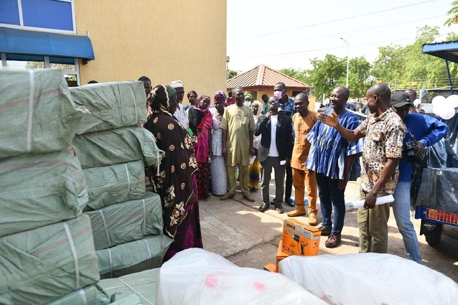 • Mr Sulemana Gbana showing the items to the beneficiaries