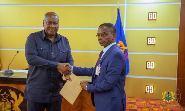 • President Mahama presenting his completed asset declaration forms to Mr Johnson Akuamoah Asiedu
