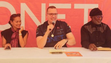 Mr Trevor Kuna (middle) speaking at the programme. With him are Mr Biram Fall (right) and Ms Victoria Ras Al-Taie