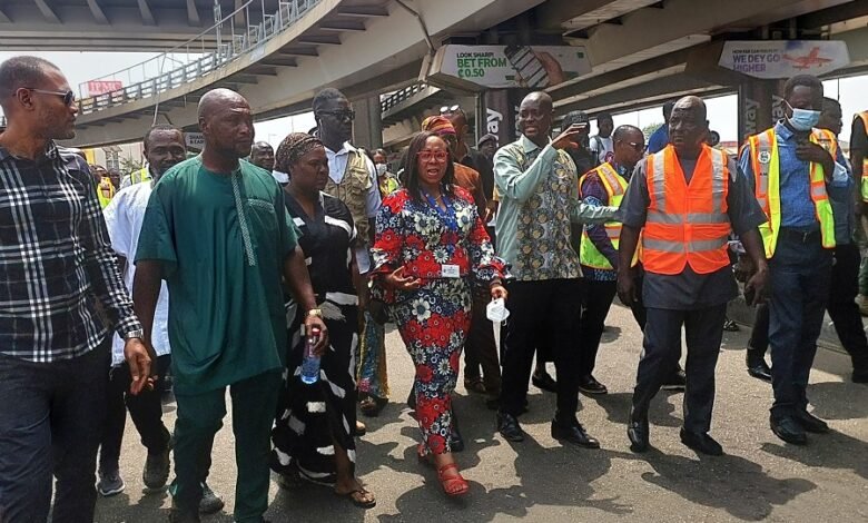 Ms Linda Ocloo, (middle) with some officials on her tour to some markets