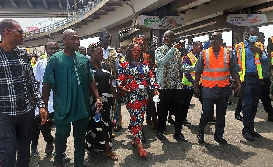 Ms Linda Ocloo, (middle) with some officials on her tour to some markets