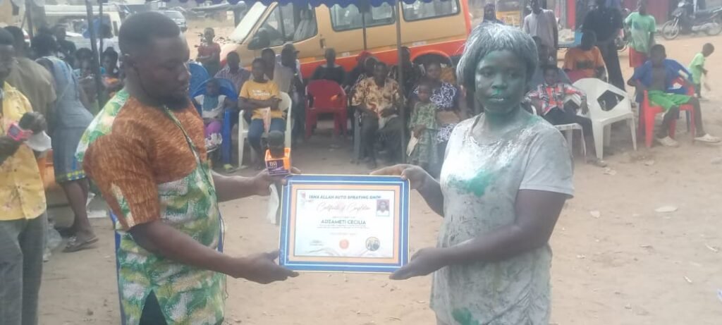 • Ms Cecilia Enyonam Gyamiti (right) receiving her certificate