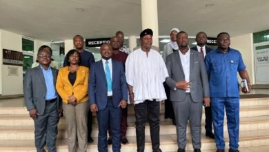 Mr Joseph Nikpe (third right), Chief Executive of DVLA, Mr Julius Neequaye Kotey (second right) with some Executives after the visit