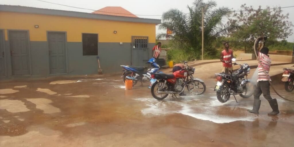 • Workers busy at the washing bay at Battor Agboganu