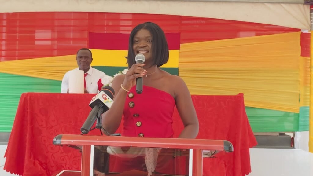 Madam Magdalene Dzifa Adzanu (inset) addressing the school children at the independence day celebration parade