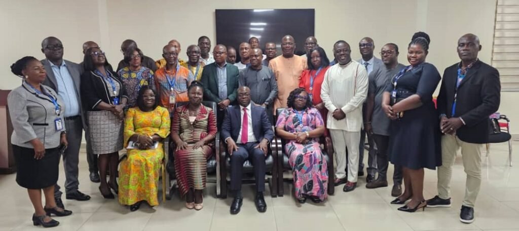 • Mr Kpekpena (middle) with some managers and staff members of ECG