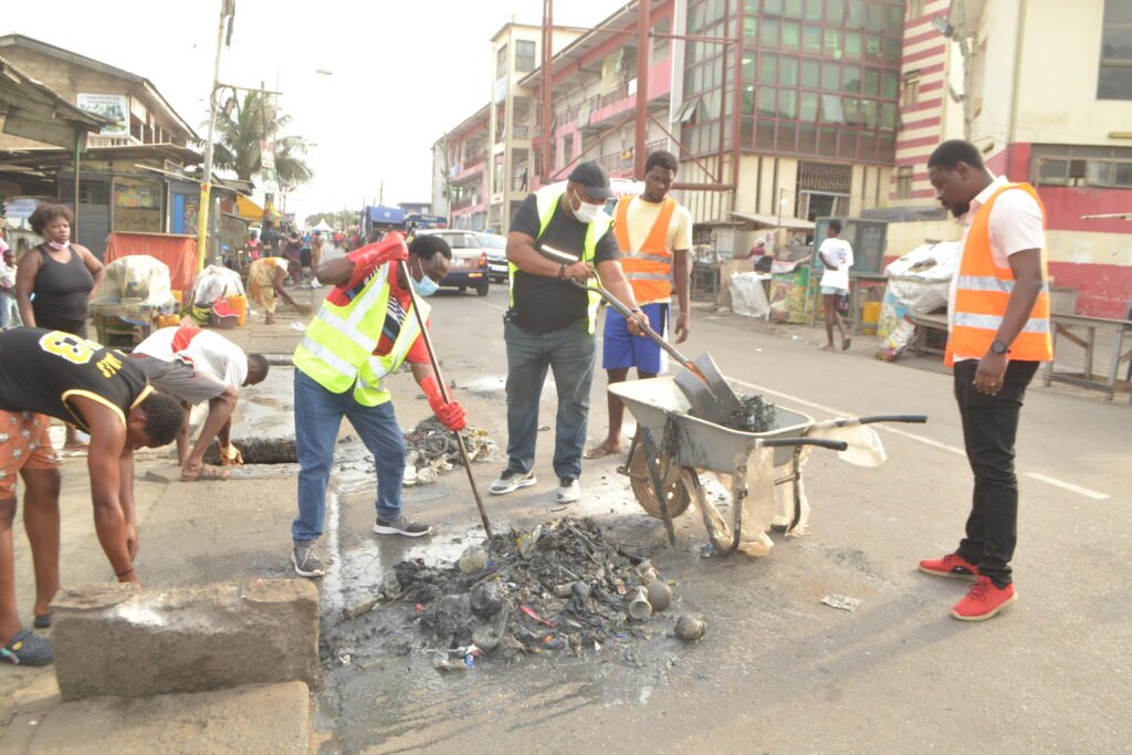 • Mr Nkrumah (left) and others at the clean up in La Photo: Victor A. Buxton.