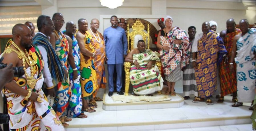 • Nii Gbese (seated in state) with Mrs Palmer (fifth from right) and members of the traditional council