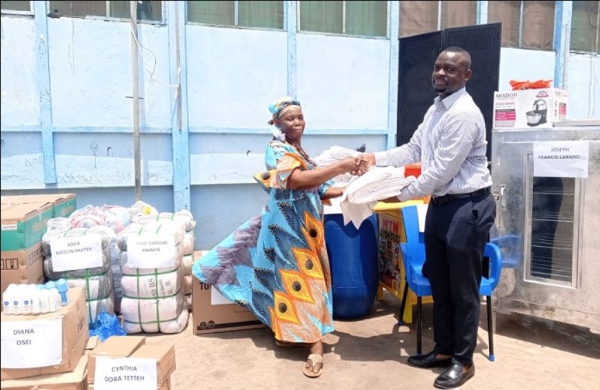 • Anthony Agyei (right), Head of Budget at TMA, presenting an item to a beneficiary