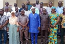 Mr Ali Adolf John Nburidiba (middle) with the MMDCDs